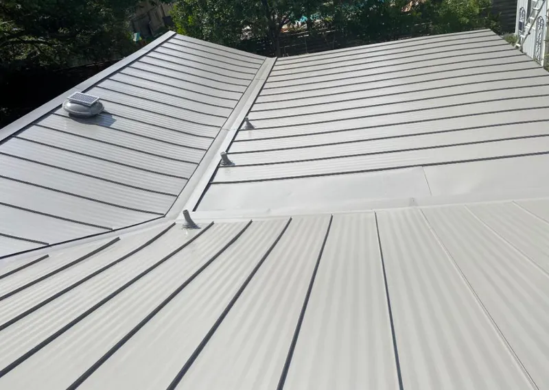 Solar attic fan installed on a metal roof for Roof Ventilation in Princeton